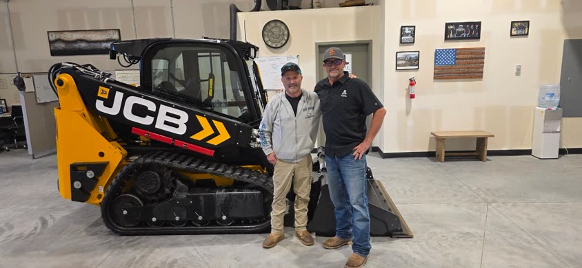 Taking delivery of a new JCB tracked loader.