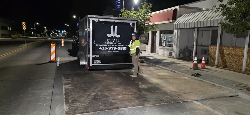 J&J branded trailer at a night work site.