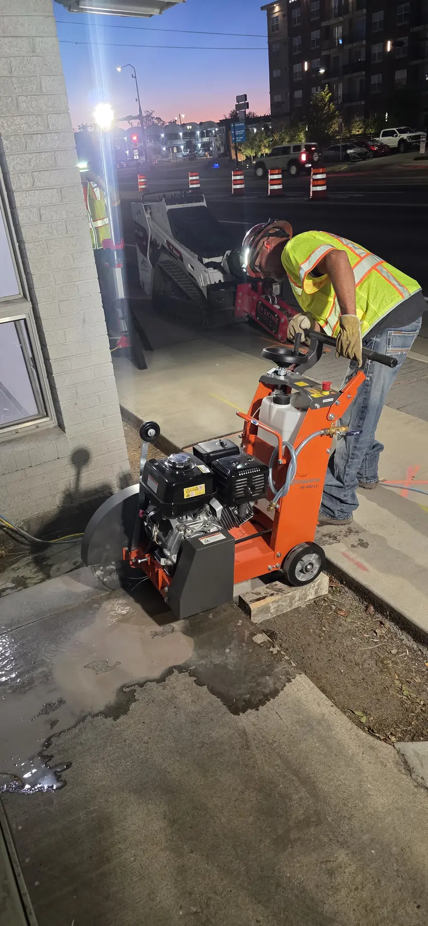 Sawcutting and pavement work during restoration.